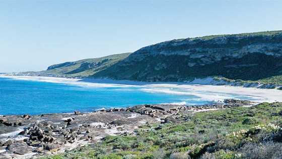 Couple walking near Sugarloaf Rock, Leeuwin-Naturaliste National Park