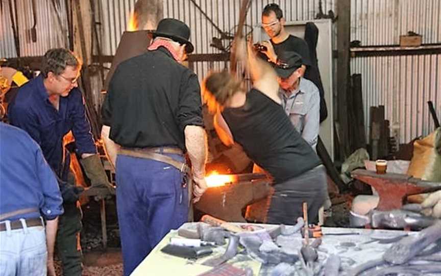 Blacksmiths at work in their forge