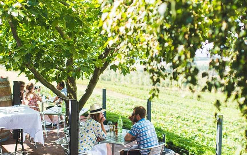 Diners enjoy the view overlooking the Pinot Noir grapes at Sisters Rock Restaurant, Borrodell Estate