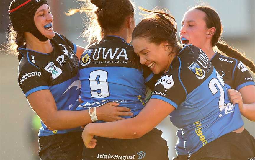 Western Force Women players celebrate a try.