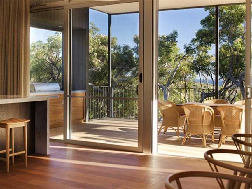 Glimpses of the ocean through the treetops, from the Kitchen