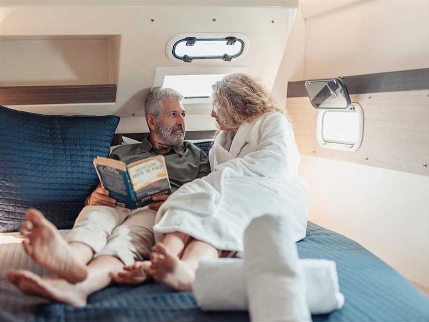 Guests relaxing in their stateroom