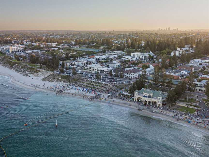 Swimmers entering the water from Perth's Cottesloe Beach