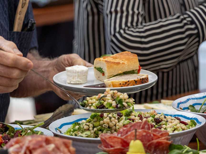 Festival guests enjoy a delicious picnic lunch on the lawns of Cape Mentelle